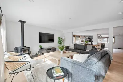 a living room with a couch and a fireplace at Chateau Bungalow - Ski Belleayre, Hunter in Shandaken