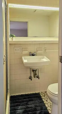 a bathroom with a sink and a toilet at Modern 4BDRM West Hartford Home In Great Location! in West Hartford