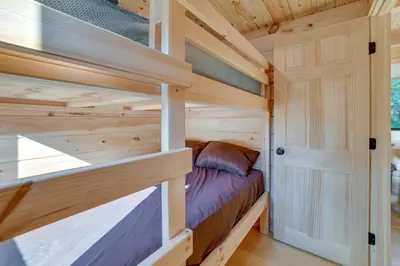 a bedroom in a tiny house at Catskills Tiny Home Cabin Surrounded by Nature! in Franklin