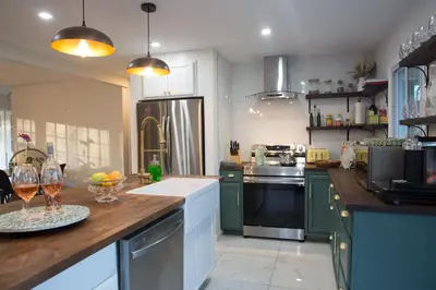 a kitchen with green cabinets and a wooden counter top at Hudson Valley Cottage Rental 3 bedrooms Monroe NY in Monroe