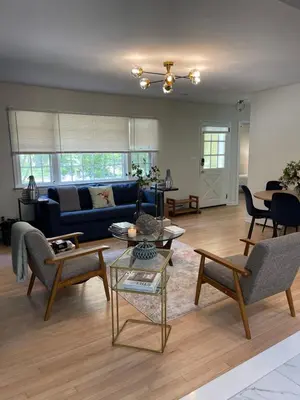 a living room with a blue couch and chairs at Hudson Valley Cottage Rental 3 bedrooms Monroe NY in Monroe