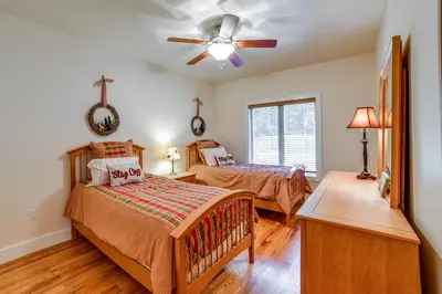 a bedroom with two beds and a ceiling fan at 2 Mi to Elk Mountain Secluded Union Dale Home! in Pleasant Mount