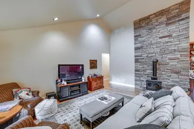 a living room with a couch and a fireplace at 2 Mi to Elk Mountain Secluded Union Dale Home! in Pleasant Mount