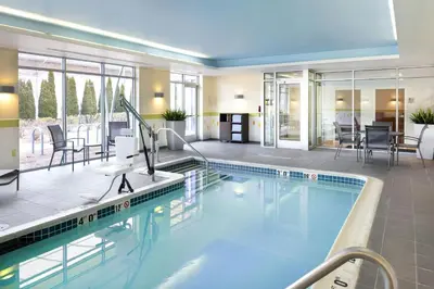 a large swimming pool in a hotel room at Fairfield Inn & Suites by Marriott Springfield Northampton/Amherst in Northampton