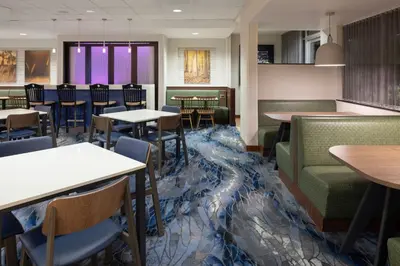 a dining room with tables and chairs and tablesktop at Fairfield Inn & Suites by Marriott Springfield Northampton/Amherst in Northampton