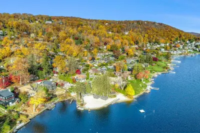 an aerial view of a home on an island in the water at Candlewood Lake House in Danbury
