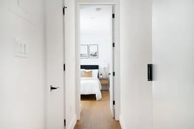 a hallway with two doors leading to a bedroom at 1290-13 Newly Renovated 2 Bedrooms in UES in New York