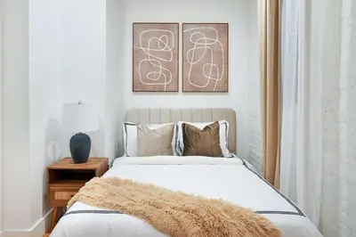 a bedroom with a bed with a furry blanket on it at 1290-8 New Renovated 2 Bedrooms in UES in New York