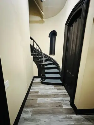 a hallway with a spiral staircase in a building at Spacious Apartment Downtown Albany, NY in Albany
