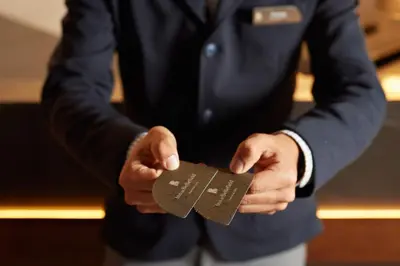 a man holding a piece of paper in his hands at Inn at Bellefield Residence Inn by Marriott in Hyde Park