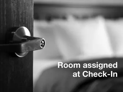 a room assigned at check in written on a wooden door at The Central Park North in New York