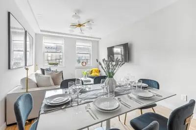 a dining room with a table and chairs at 3BR Penthouse Suite with Massive Private Rooftop in New York