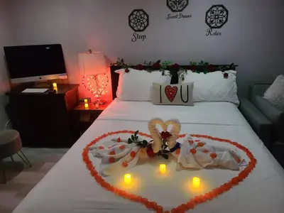 a bed with a heart made out of lights on it at Lovely 2 bedroom Apartment with 2 Entrance and Parking with a fee in University Heights