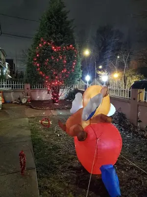 a large balloon shaped like a teddy bear sitting on a red ball at Lovely 2 bedroom Apartment with 2 Entrance and Parking with a fee in University Heights