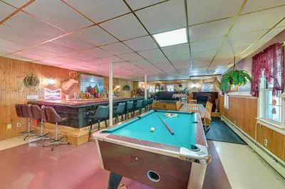 a billiard room with a pool table and a bar at Lanesville Home with Pool Table, Bar and Deck! in Lanesville