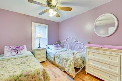 a bedroom with two beds and a ceiling fan at Lanesville Home with Pool Table, Bar and Deck! in Lanesville