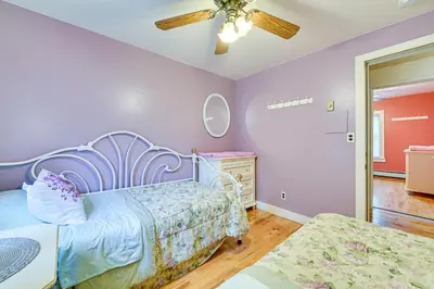 a bedroom with two beds and a ceiling fan at Lanesville Home with Pool Table, Bar and Deck! in Lanesville