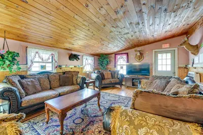 a living room with leather furniture and a wooden ceiling at Lanesville Home with Pool Table, Bar and Deck! in Lanesville
