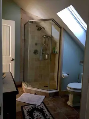 a bathroom with a shower and a toilet at Waterfront Home on Bantam Lake with Private Beach in Morris