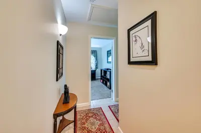a hallway with a door leading into a room at Quiet Killingworth Rental with Deck and Grill! in Deep River