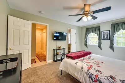 a bedroom with a bed and a ceiling fan at Quiet Killingworth Rental with Deck and Grill! in Deep River