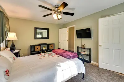 a bedroom with a bed and a ceiling fan at Quiet Killingworth Rental with Deck and Grill! in Deep River