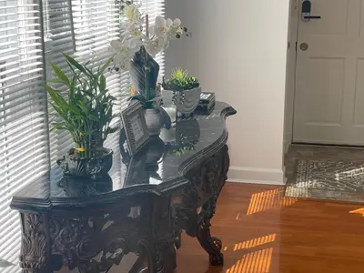 a table with potted plants on top of it at Jersey home, close to New York City fun! in Englewood