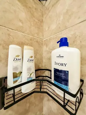 two bottles ofodorizers on a shelf in a bathroom at Luxury Style 2 King Bed WD FREE Garage in Schenectady