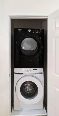 a washer and dryer in a room at Luxury Stylish Townhome King Beds WD Garage in Schenectady