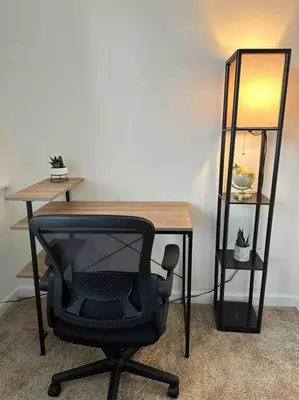 a desk with a chair and a desk with a lamp at Luxury Stylish Townhome King Beds WD Garage in Schenectady