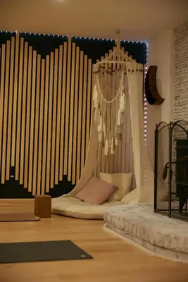 a bedroom with a bed with a chandelier at Sowilo All-inclusive Resort in Greenwich