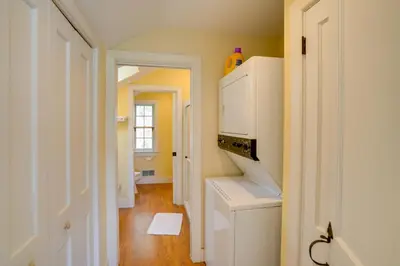 a kitchen with a white refrigerator and a hallway at Historic New Lebanon Hideaway on 33 Private Acres! in New Lebanon