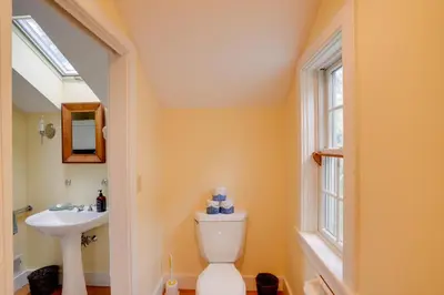 a bathroom with a toilet and a sink at Historic New Lebanon Hideaway on 33 Private Acres! in New Lebanon