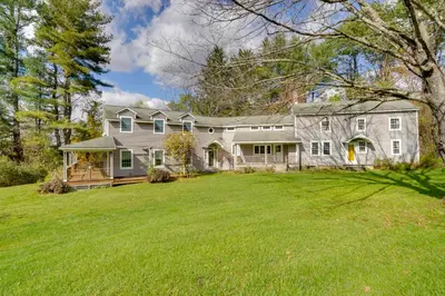 a large gray house with a large yard at Historic New Lebanon Hideaway on 33 Private Acres! in New Lebanon