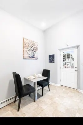 a dining room with a table and two chairs at Escape your everyday in your COZY HIDEAWAY Feel right at home Relax recharge & unwind in Troy
