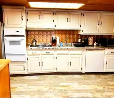 a white kitchen with white cabinets and appliances at INCREDIBLE Northern Westchester Historic Hideaway in South Salem