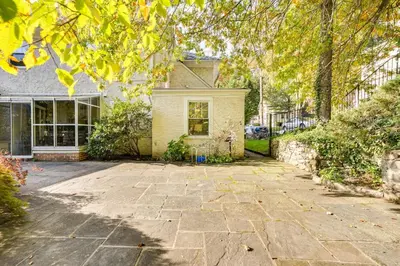 a stone driveway in front of a house at Walk to Harbor! Historic Mamaroneck Guest House in Mamaroneck