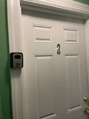 a white door with a number three on it at Mo Short Term Rentals in Mount Vernon