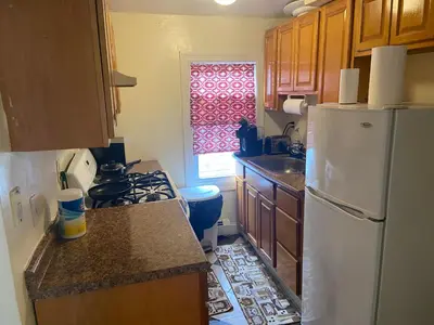 a kitchen with a white refrigerator and a sink at Mo Short Term Rentals in Mount Vernon