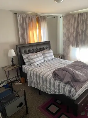 a bedroom with a bed and a window at Mo Short Term Rentals in Mount Vernon