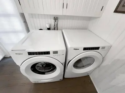 two washing machines sitting next to each other in a bathroom at Historic Estate - 5 min to Mohawk Mt Ski Resort in Cornwall