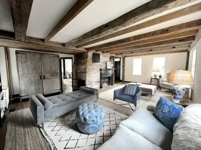 a living room with couches and a fireplace at Historic Estate - 5 min to Mohawk Mt Ski Resort in Cornwall