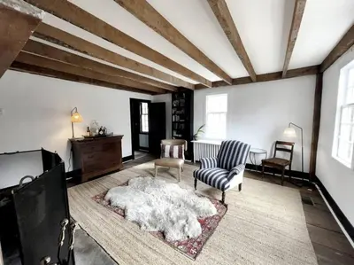 a living room with a couch and a chair at Historic Estate - 5 min to Mohawk Mt Ski Resort in Cornwall
