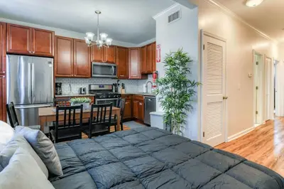 a kitchen with a large bed in a room at Modern 3BR2BA Apartment Minutes to NYC in Jersey City
