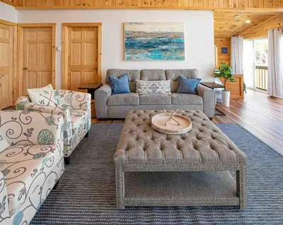a living room with a couch and a coffee table at Madison Cabin #2 in Hamilton
