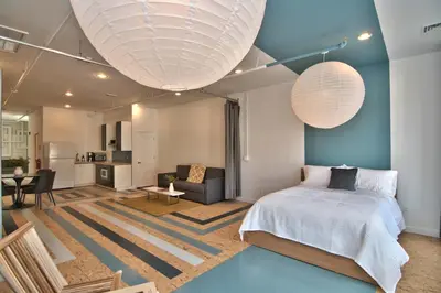 a bedroom with a bed and a living room at Wonder Loft A3 - Main St. Honesdale in Honesdale