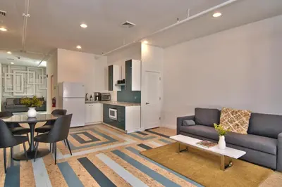 a living room with a couch and a table at Wonder Loft A3 - Main St. Honesdale in Honesdale