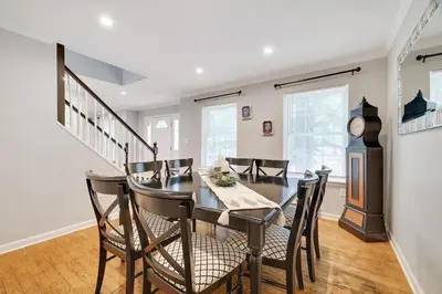 a dining room with a table and chairs at Nature’s Haven:4 br/2.5 bath, game room & Fire pit in Tobyhanna