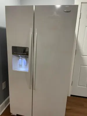 a white refrigerator with its door open in a kitchen at Comfy 3 Bed 1 Bath with Wifi in College and Restaurant Area in Springfield