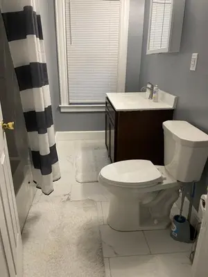 a bathroom with a toilet and a sink at Comfy 3 Bed 1 Bath with Wifi in College and Restaurant Area in Springfield